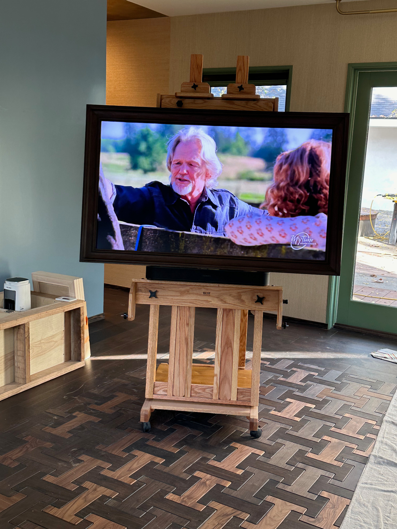 Freestanding television setup on an easel display