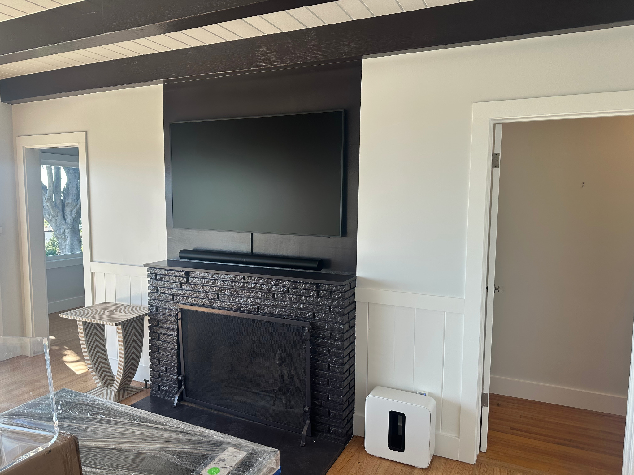 Television and Sonos installation above a fireplace